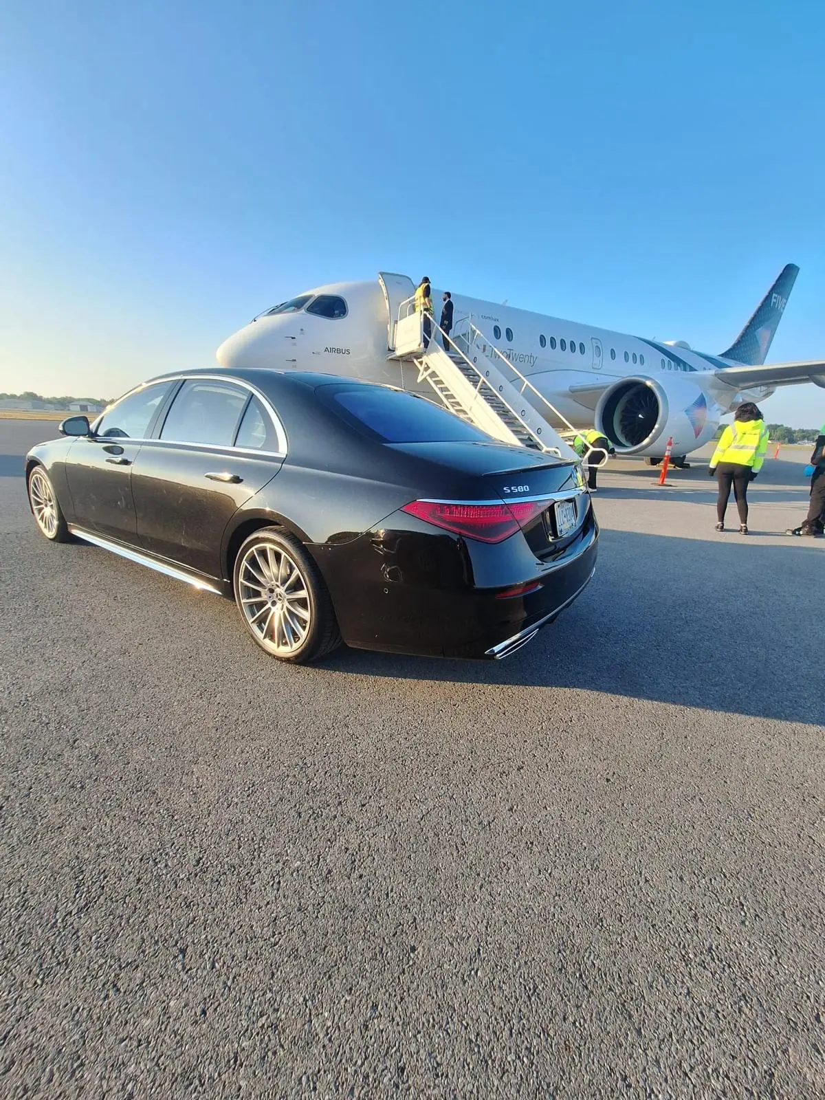 All Quest Limousine chauffeur with a black car in Fairfield County, CT